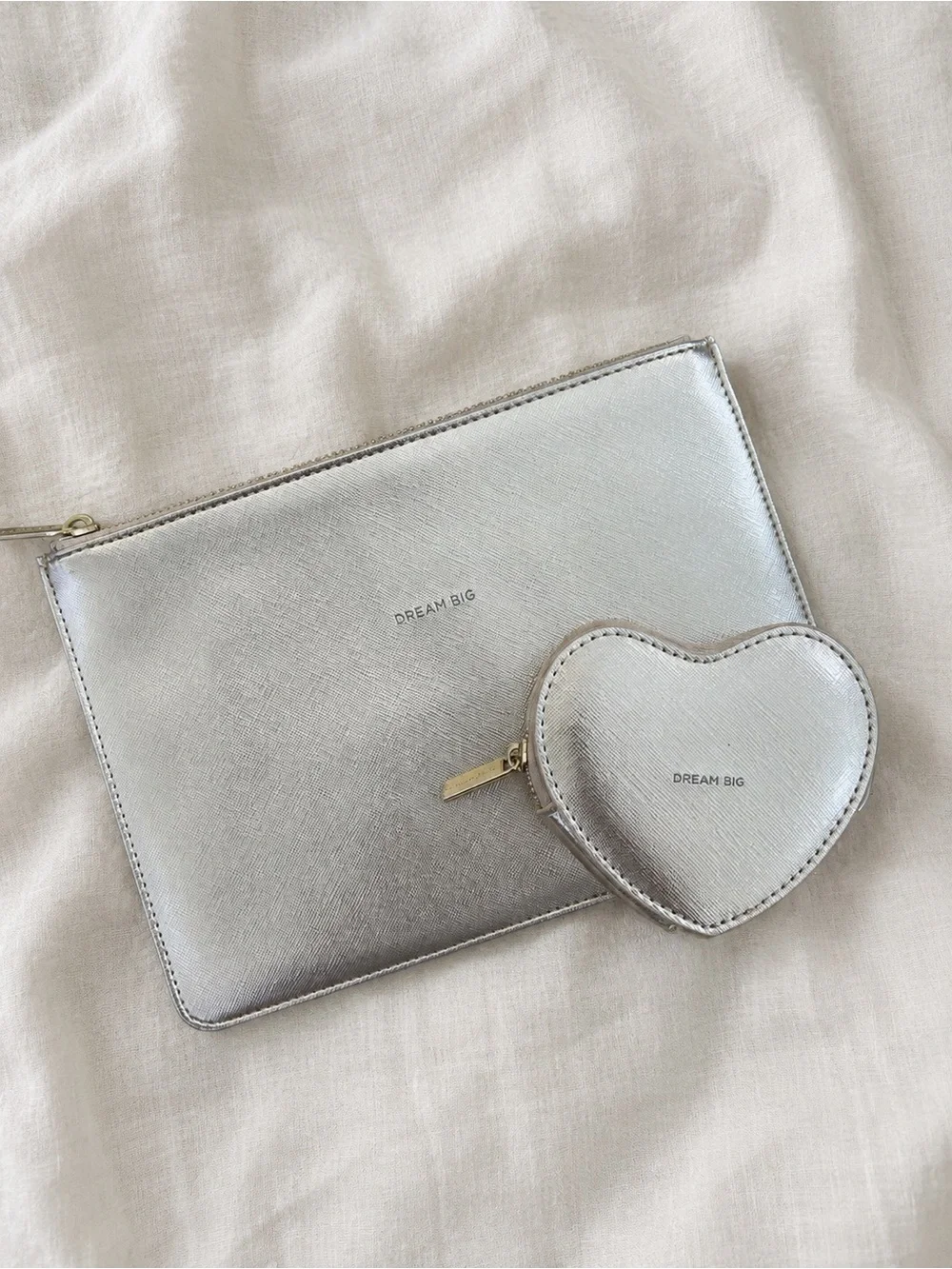 Cutest set of little pouches by Estella Bartlett. Metallic champagne/silver